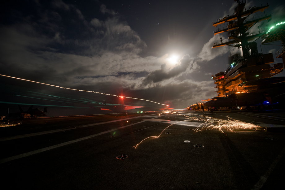 An F/A-18F Super Hornet assigned to the Swordsmen of Strike Fighter Squadron 32 lands on the flight deck of the aircraft carrier USS Dwight D. Eisenhower.