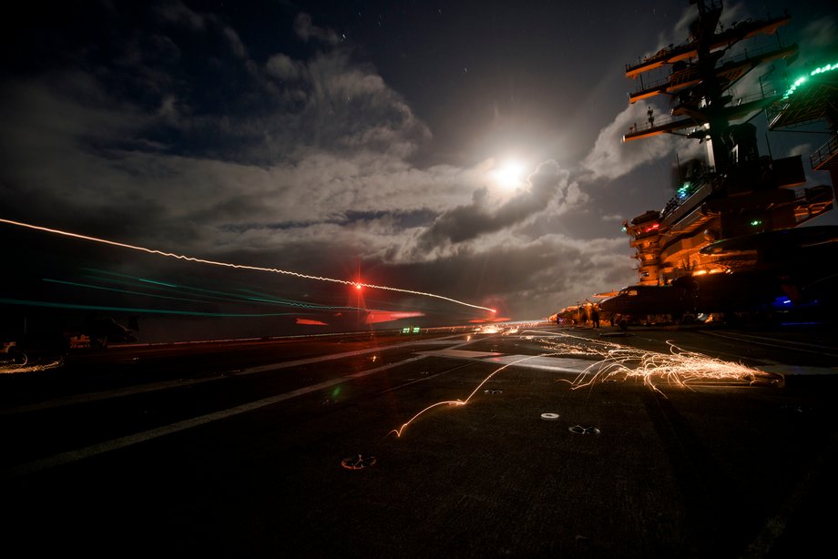 An F/A-18F Super Hornet assigned to the Swordsmen of Strike Fighter Squadron 32 lands on the flight deck of the aircraft carrier USS Dwight D. Eisenhower.