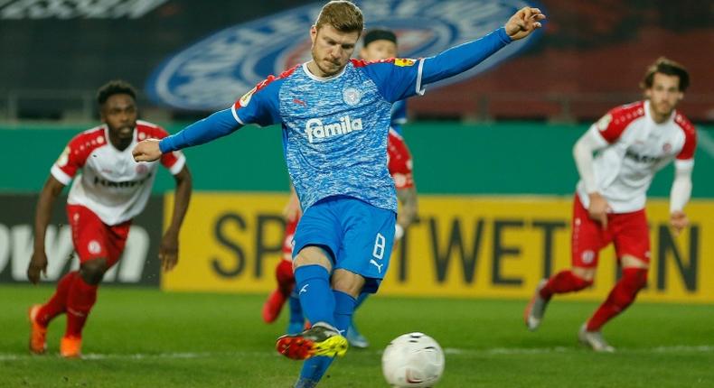 Holstein Kiel midfielder Alexander Muehling nets their first-half penalty at Kiel