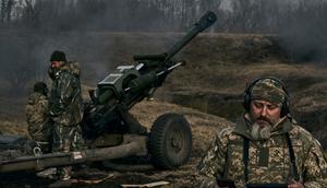 Ukrainian soldiers fire a self-propelled howitzer towards Russian positions near Bakhmut, the site of the heaviest battles, Donetsk region, Ukraine, on March 7, 2023.AP Photo/Libkos
