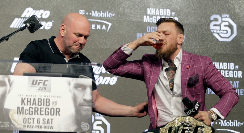 McGregor slugging whiskey at the prefight press conference in September.