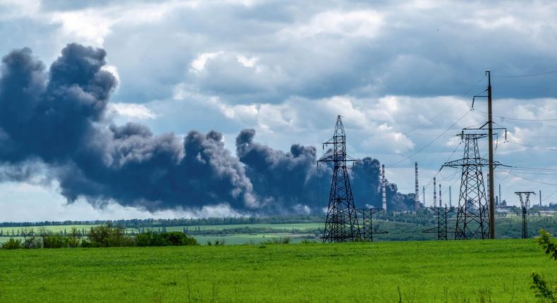 A plume of smoke rising after Russian shells hit an oil refinery in Lysychansk in the Luhansk Oblast, Ukraine, in May 2022.Getty Images