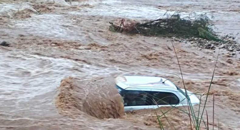 Vehicle swept away by floods