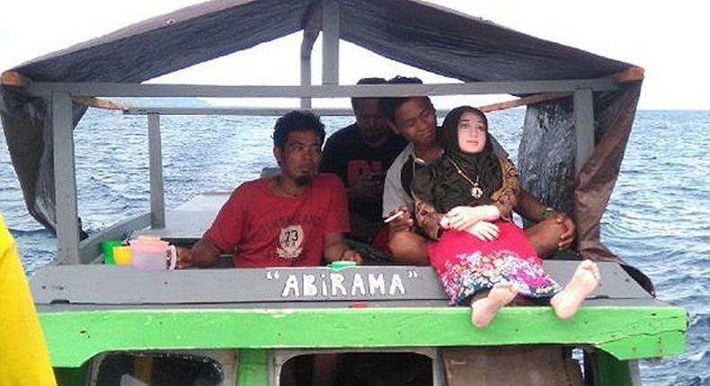 Fallen angel with villagers on a boat trip