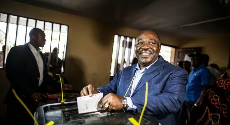 Gabonese President Ali Bongo Ondimba arrives to cast his vote at a polling station in Libreville