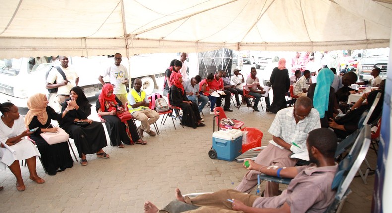 People donating blood at a camp set up by Red Cross during Dusit attack