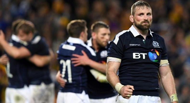 Scotland's captain John Barclay (R) celebrates after beating Australia in their rugby union Test match in Sydney, on June 17, 2017