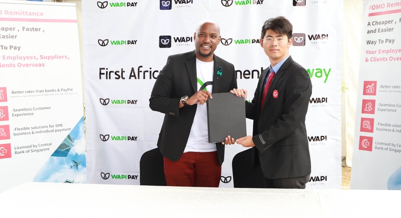 Wapi Capital Exec Dir Paul Ndichu and Fomo Pay Co-Founder Zack Yang at the signing. (courtesy)