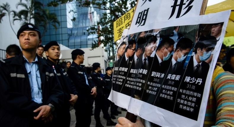 Seven Hong Kong police officers are jailed for two years after being found guilty of assualt on a pro-democracy demonstrator in 2014