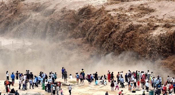 Tourists Visit Hukou Waterfall In China