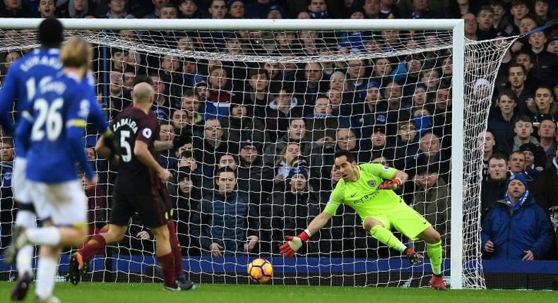 Manchester City's goalkeeper Claudio Bravo cannot stop Everton's striker Kevin Mirallas's shot for their second goal during the English Premier League football match at Goodison Park in Liverpool, north-west England on January 15, 2017