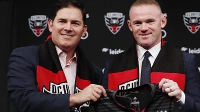 Jason Levien (left) with Wayne Rooney.Patrick McDermott/Getty Images