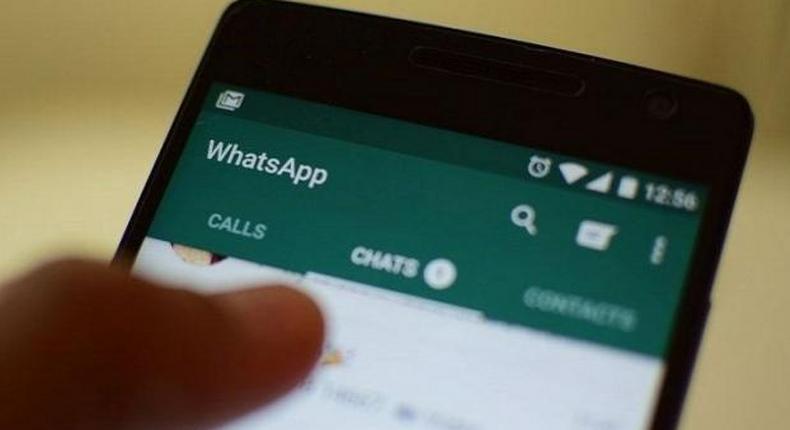 A user views WhatsApp messenger on his phone (twitter)