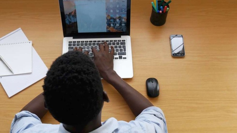 Man typing on a computer (Stock image) 