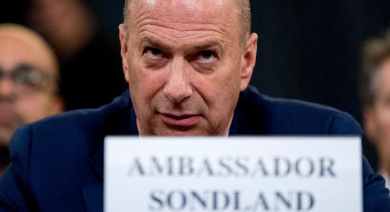 Ambassador Gordon Sondland, U.S. Ambassador to the European Union, center, appears before the House Intelligence Committee on Capitol Hill in Washington, Wednesday, Nov. 20, 2019, during a public impeachment hearing of President Donald Trump's efforts to tie U.S. aid for Ukraine to investigations of his political opponents. (AP Photo/Andrew Harnik)