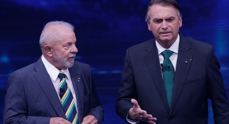 Luiz Incio Lula Da Silva and Jair Bolsonaro speak to each other during the presidential debate ahead of the runoff, on October 16, 2022 in Sao Paulo, Brazil.Alexandre Schneider/Getty Images