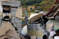 Collapsed houses are seen after an earthquake hits the island of Ischia, off the coast of Naples