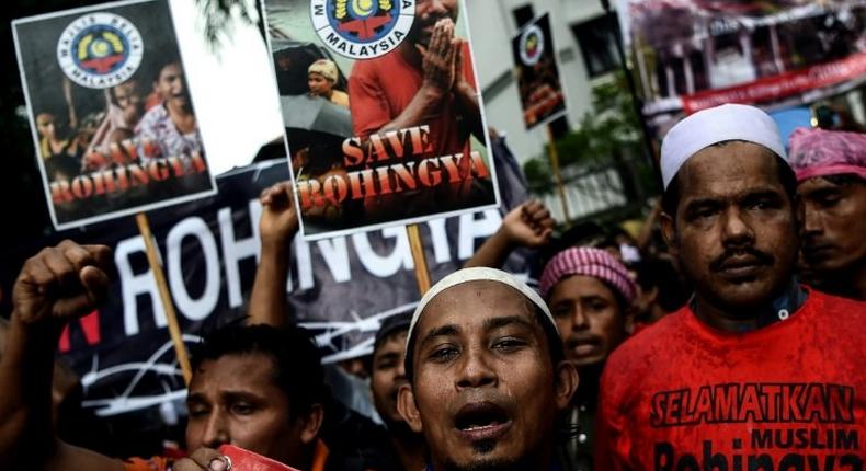 Ethnic Rohingya Muslim refugees shout slogans during a protest against the persecution of Rohingya Muslims in Myanmar, outside the Myanmar embassy in Kuala Lumpur on November 25, 2016