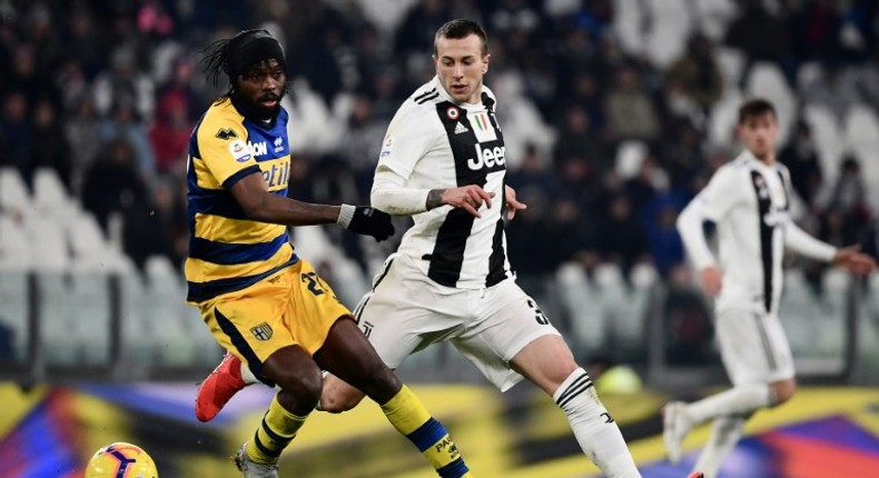 Parma's Ivorian forward Gervinho (L) holds off Juventus' Italian forward Federico Bernardeschi during the Italian Serie A football match Juventus vs Parma on February 2, 2019 at the Juventus stadium in Turin.