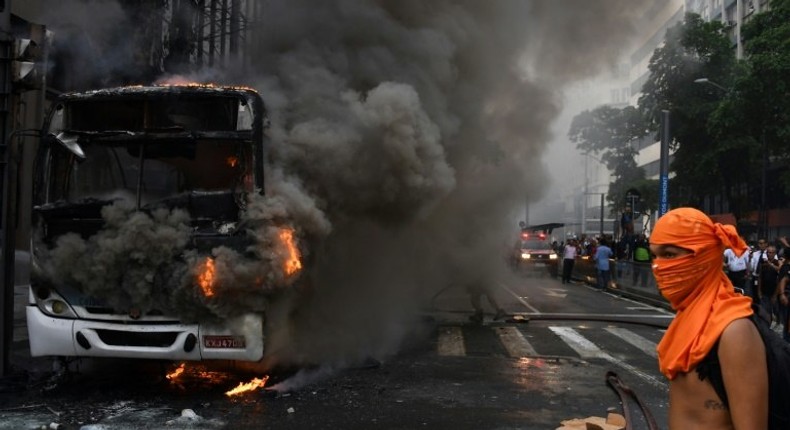 Buses were torched as Brazilian anti-austerity protesters clashed with riot police in Rio de Janeiro, on February 1, 2017