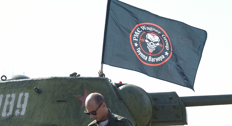 A man is seen in front of a flag of Wagner group mounted on top of an old tank exhibited at the Leninist Komsomol park in Donetsk, Russian-controlled Ukraine, on October 1, 2023.STRINGER/AFP via Getty Images