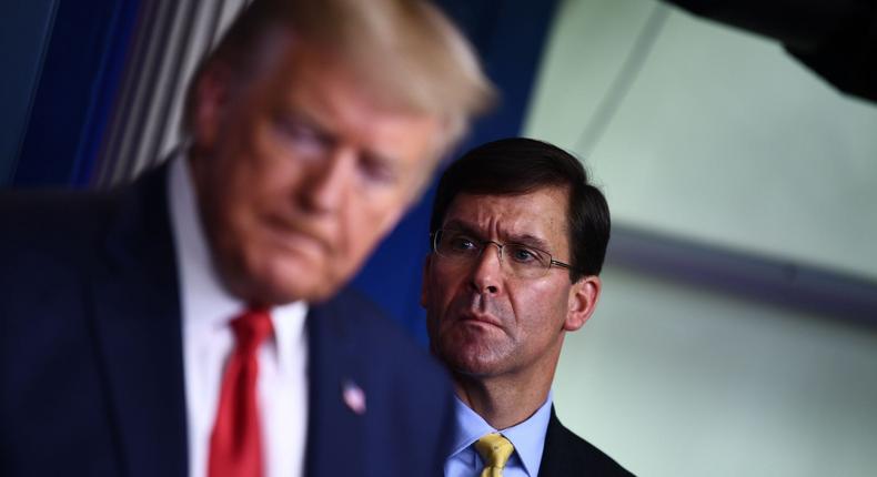 Defense secretary Mark Esper looks on as President Donald Trump addresses White House reporters in March 2020.