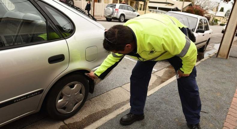 Parking police scramble as court tells them to put away the chalk