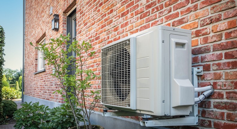 Electric heat pumps are energy efficient and don't burn fossil fuels.Nancy Pauwels/Getty Images.