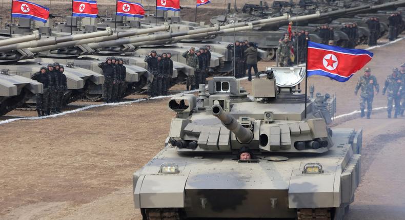 North Korean leader Kim Jong Un sits inside a tank during a military demonstration involving tank units, in North Korea.KCNA via Reuters