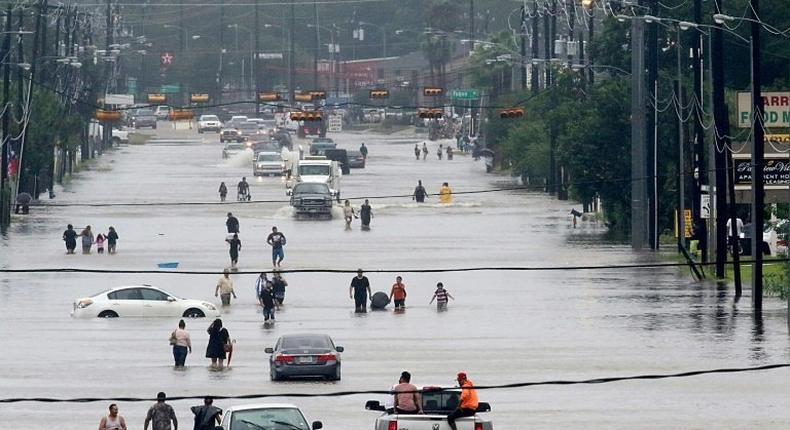 At least three people have been killed in the widespread flooding caused by tropical storm Harvey in Houston