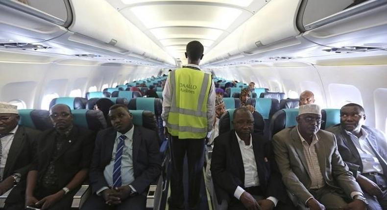 A member of Daallo Airlines ground crew walks down an aisle inside their airline at Aden Abdule International Airport in Somalia's capital Mogadishu in a file photo. REUTERS/Feisal Omar