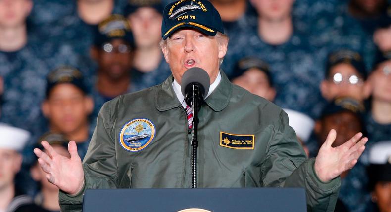 President Donald Trump gestures as he speaks to Navy and shipyard personnel aboard nuclear aircraft carrier Gerald R. Ford at Newport News Shipbuilding in Newport News, Va., Thursday, March 2, 2017. The ship which is still under construction is due to be delivered to the Navy later this year.