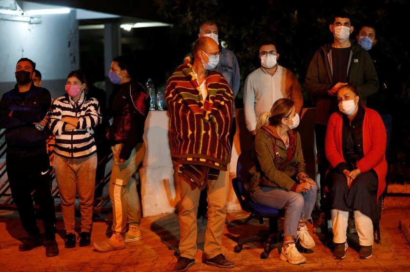 Rescue operations take place on a site after an earthquake struck the Aegean Sea, in the coastal pro