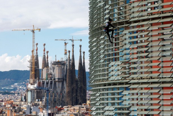 French climber Alain Robert, also known as The French Spiderman, scales the 38-story skyscraper To