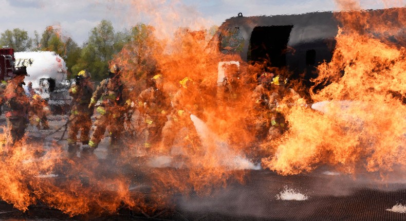 U.S. Air Force firefighters, assigned to the 180th Fighter Wing, Ohio Air National Guard, spray water on a fire May 10, 2018 during training exercises at the Toledo Express Airport in Swanton, Ohio.