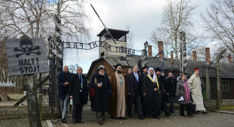 Muslim World League head  Mohammad bin Abdulkarim Al-Issa and American Jewish Committee leader David Harris among those at the infamous gates of the former Nazi German death camp Auschwitz