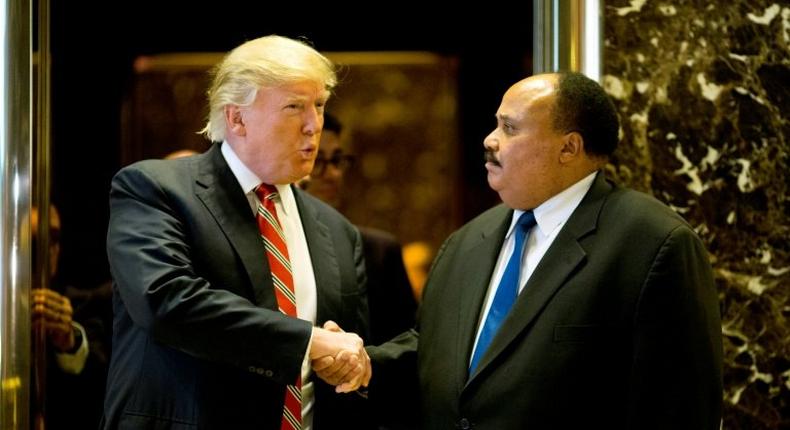 US President-elect Donald Trump shakes hands with Martin Luther King III after a meeting at Trump Tower in New York City