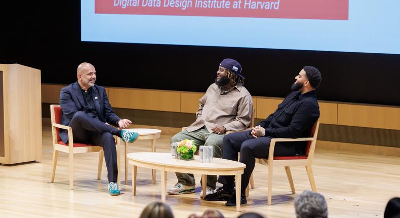 Bas, a rapper, and Derek Ali, a sound engineer, speak at the panel Creativity in AI with Music at the Leading with AI conference. The Digital Data Design Institute's director, Karim Lakhani, moderated the panel.Russ Campbell