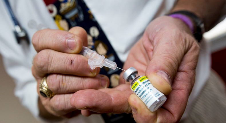 Pediatrician Richard K. Ohnmacht prepares a shot of the HPV vaccine Gardasil for a patient at his office in Cranston, Rhode Island, Sept. 3, 2015