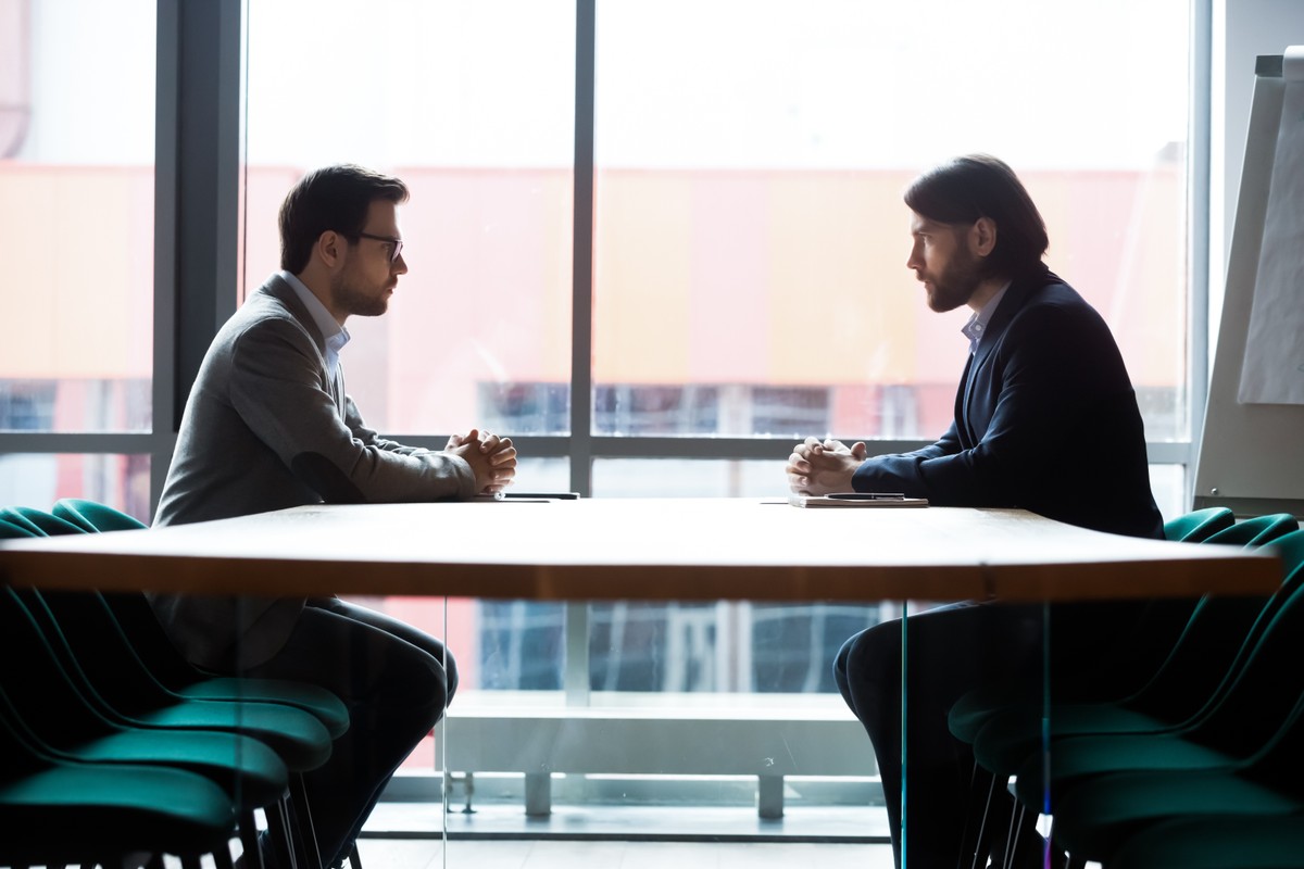 Side,View,Full,Length,Two,Concentrated,Successful,Businessmen,Sitting,Opposite