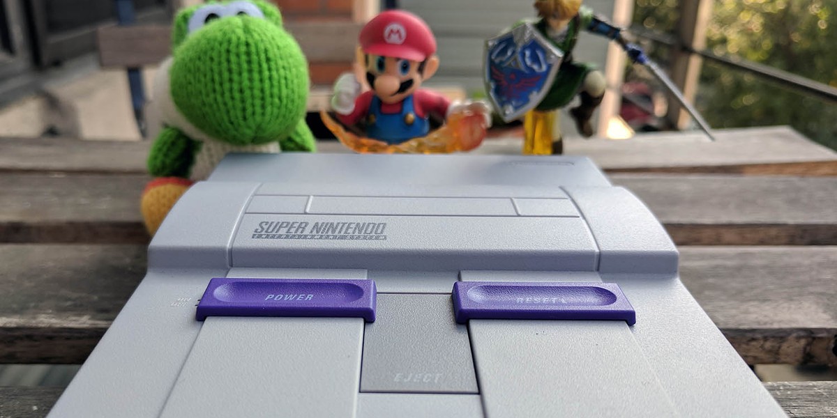 The Super NES Classic Edition is so small that these Amiibo figures tower over it.