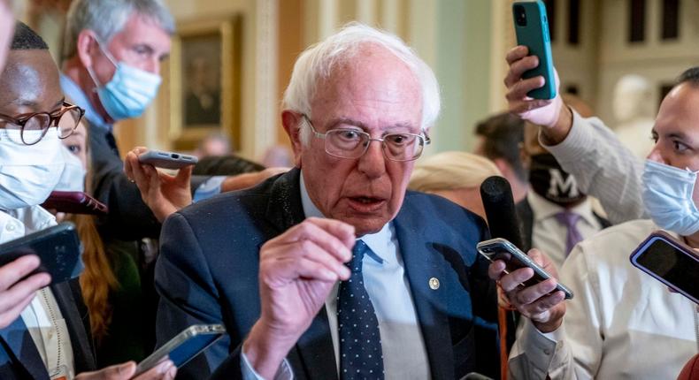 Sen. Bernie Sanders, I-Vt., speaks to reporters as he leaves a Democratic strategy meeting at the Capitol in Washington, Tuesday, Oct. 19, 2021.
