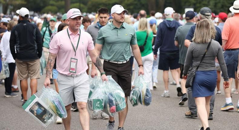 Patrons at the Masters tournament lug around multiple bags, including the hottest item of all: the garden gnome.Christian Petersen