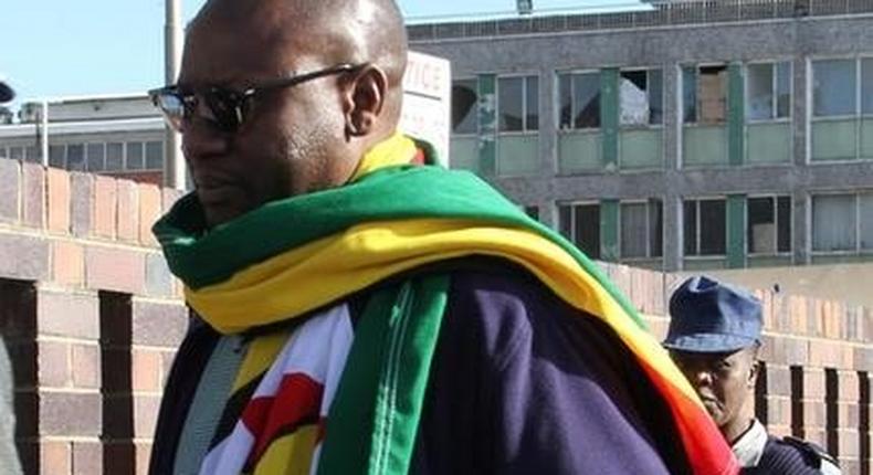 Zimbabwean Pastor Evan Mawarire , who organized a 'stay at home' anti-government protest last week, arrives at the Harare Central Police station in Zimbabwe, July 12, 2016. 