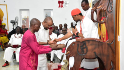 Majority Leader of Delta House of Assembly, Mr Emeka Nwaobi (second left), receiving royal blessings from Obi Nduka Ezeagwuna, the traditional ruler of Issele-Uku Kingdom in Aniocha North Local Government Area of Delta, on Thursday.