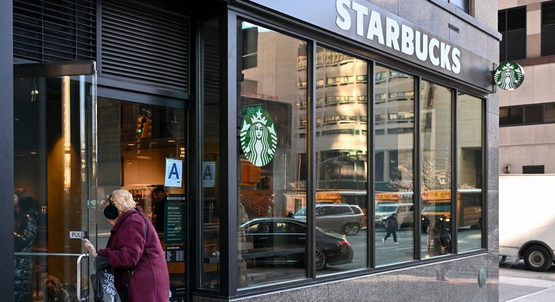 Starbucks is bringing back condiment bars and asking patrons to buy something to hang out in-store, among other changes.ANGELA WEISS / AFP via Getty Images