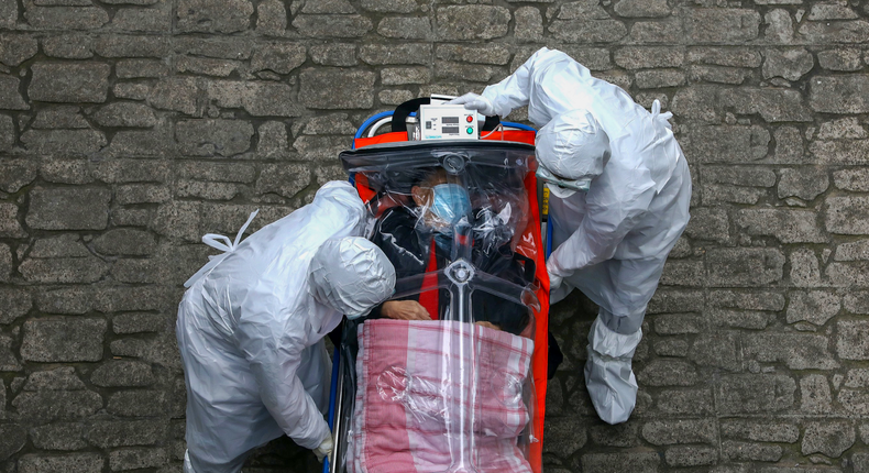 coronavirus covid 19 patient emergency workers protective equipment suits masks gloves south korea march 9 2020 GettyImages 1211268635