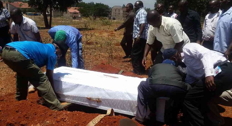 People at a past burial ceremony