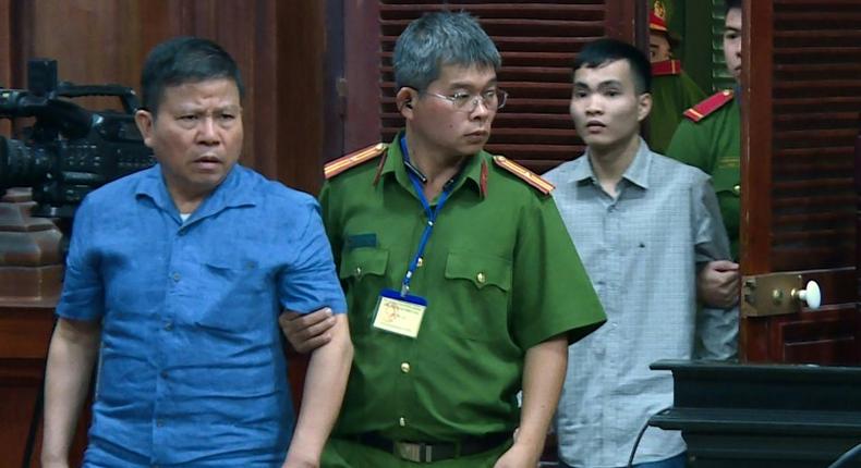 The Vietnam News Agency released a picture of  Australian citizen Chau Van Kham being escorted for trial in Ho Chi Minh City. He was jailed for 12 years on terrorism charges