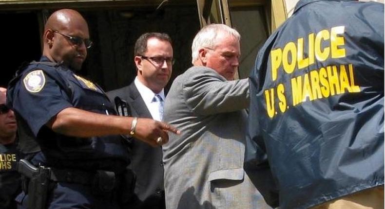 Jared Fogle (C) is led from federal court in Indianapolis, Indiana August 19, 2015. 